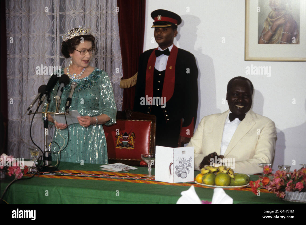 Queen Elizabeth II speaking at a State Banquet in Nairobi, Kenya, with Kenyan President, Daniel Arap Moi, watching, right. Stock Photo