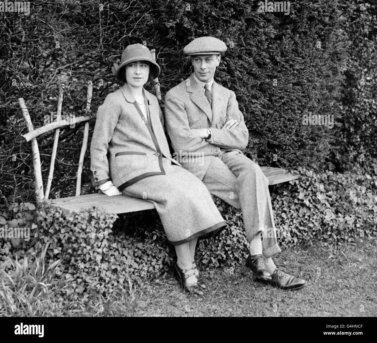 The Duke and Duchess of York (later King George VI and the Queen Mother) seated after a walk in the grounds of Polesden Lacey, near Dorking, Surrey, where they spent their Honeymoon. Stock Photo