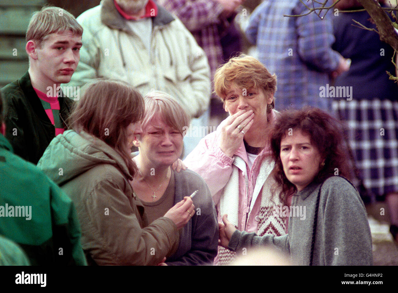 Grieving parents waiting to hear the news of the shooting incident at