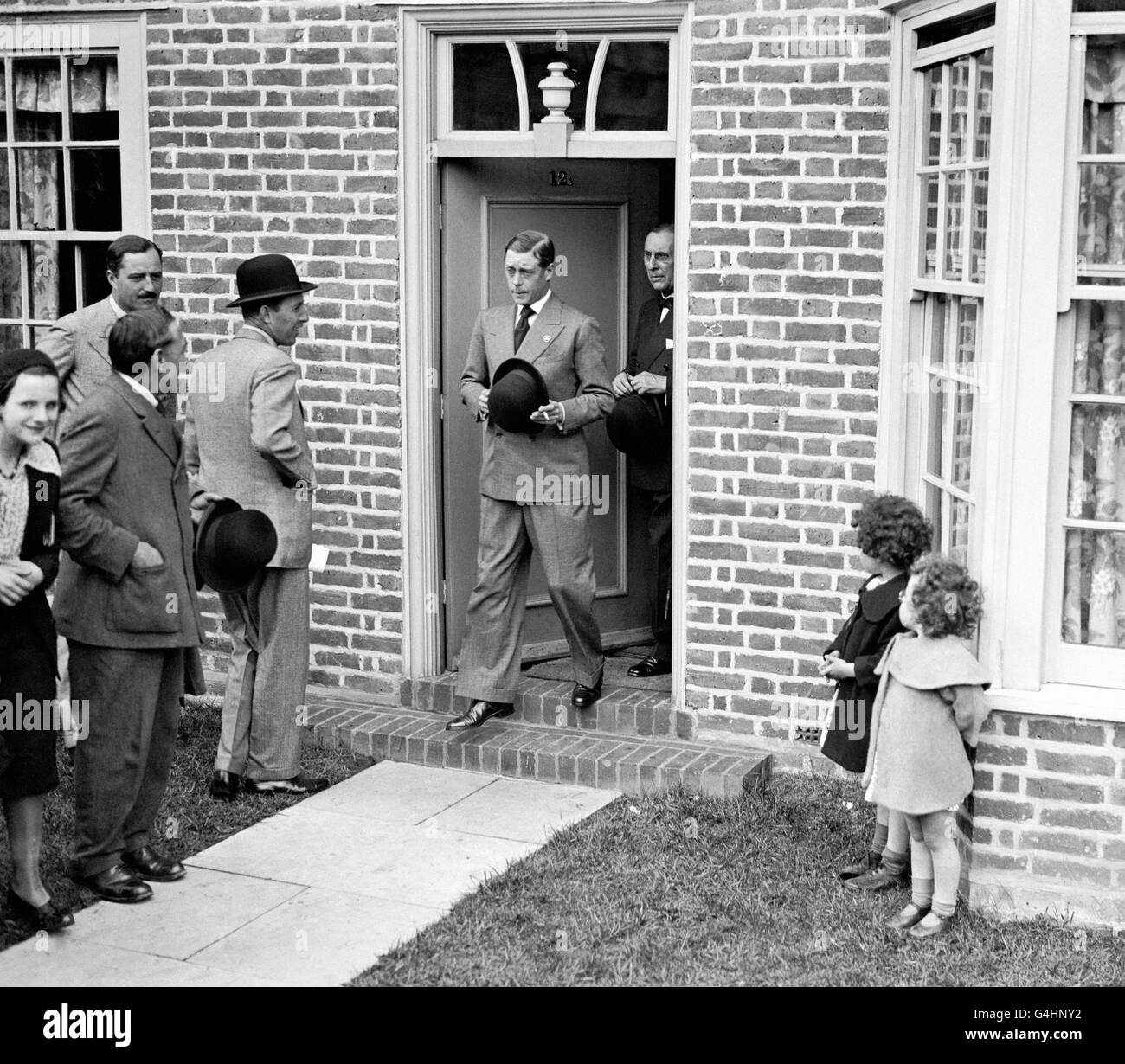 The Prince of Wales leaving one of the Haig Homes at Morden, Surrey, after the official opening. Stock Photo