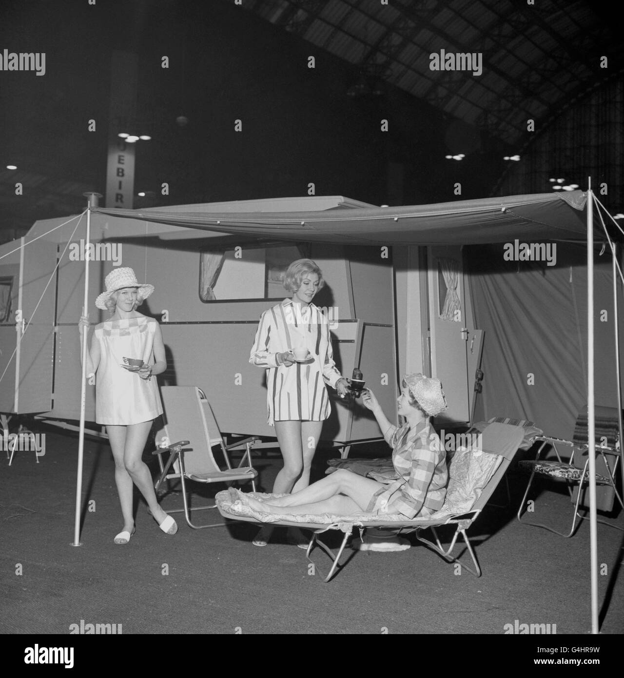 A specially-designed tent that can be erected at the rear to give additional room, measuring about 7ft.3in.by 10ft. It is a feature of the Sprite Countryman caravan and is seen being demonstrated during a preview of the International Caravan Exhibition, opening at the Olympia in London. Stock Photo