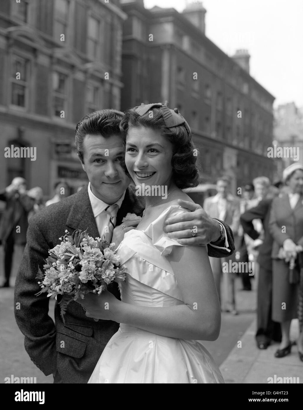 Actor-writer, Bryan Forbes, and his bride actress, Nanette Newman, leaving Caxton Hall Register Office in London after their wedding ceremony. Stock Photo