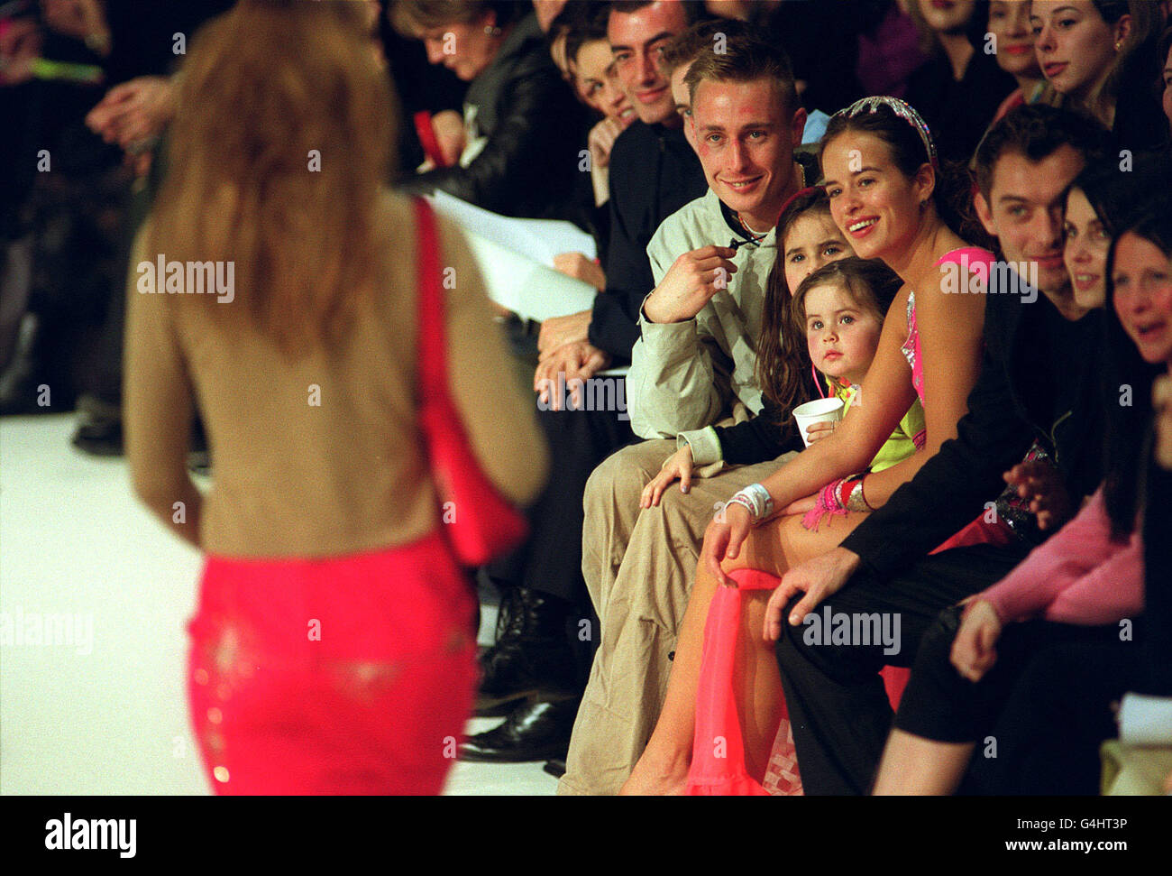 Jade Jagger, daughter of Rolling Stones Star Mick, enjoys the show from British Designer Matthew Williamson, alongside Ex-Boyfriend Euan MacDonald (left) and daughters Assisi (centre left) and Amba during London Fashion Week. *02/12/2000 Jade Jagger at the Highland Spring Face of '98. Rolling Stone lead singer's daughter Jade and two granddaughter's had a narrow escape from death when they miraculously survived a head-on crash on the island Ibiza, it emerged. Jade, in her late 20s, and her two young daughter's Amba and Assisi were travelling in a Chevrolet 4x4 jeep on the Mediterranean island Stock Photo