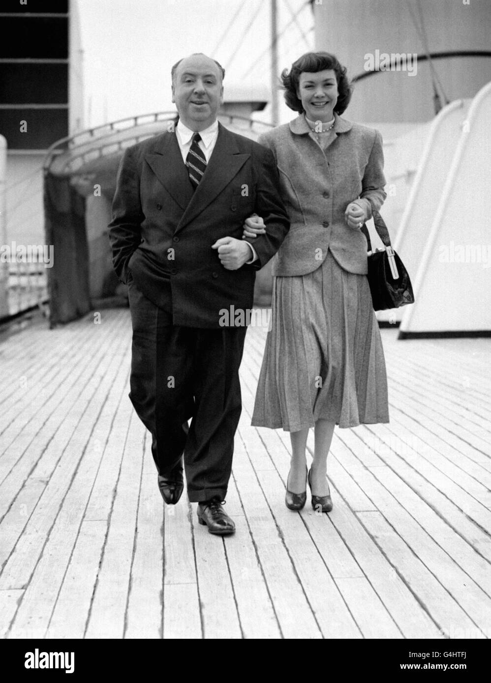 Film director Alfred Hitchcock and film star Jane Wyman aboard the Cunard liner 'Queen Mary' as it left Southampton for New York. They had just finished filming 'Stage Fright' with Marlene Dietrich at Elstree. Stock Photo
