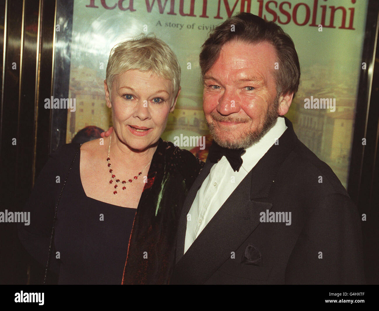 Dame Judi Dench with her husband Michael Williams at the Royal Premiere of her film 'Tea With Mussolini,' at the Empire Leicester Square, London. R/I: 25/6/99. *12/01/01 Mr Williams has died after a long battle with cancer, aged 65, his agent said. Stock Photo