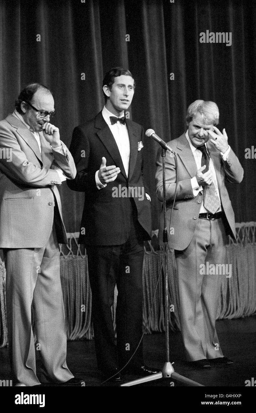 The Prince of Wales joins Eric Morecambe, left, and Ernie Wise on stage at the Theatre Royal, Windsor, during their special Royal charity show staged for the Queen's Silver Jubilee Appeal. Stock Photo