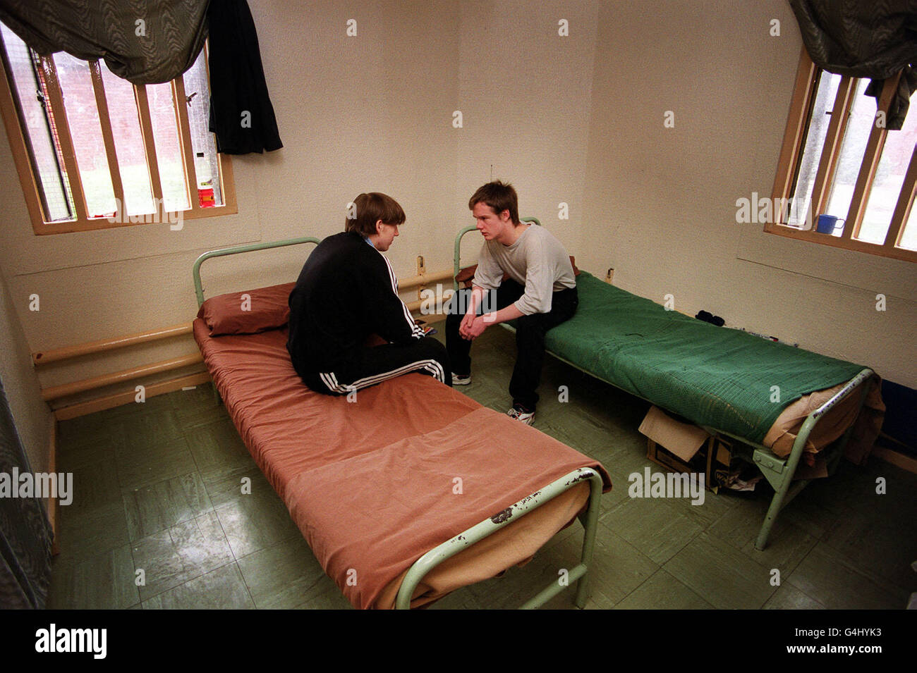 Two remand prisoners chat in their cell in Quail house block, Feltham