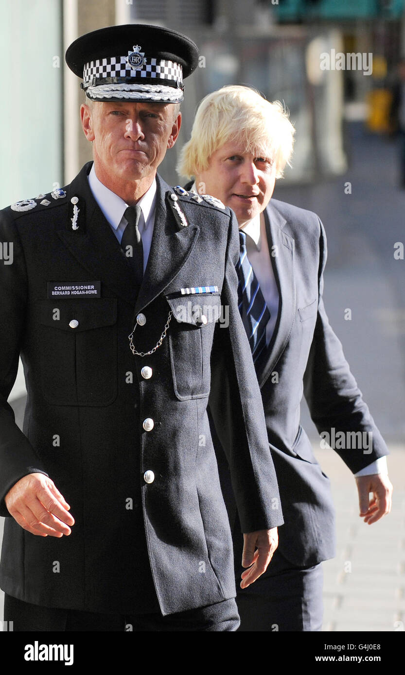 New Metropolitan Police Commissioner Bernard Hogan-Howe (left) and Mayor of London Boris Johnson are seen outside New Scotland Yard, London. Stock Photo