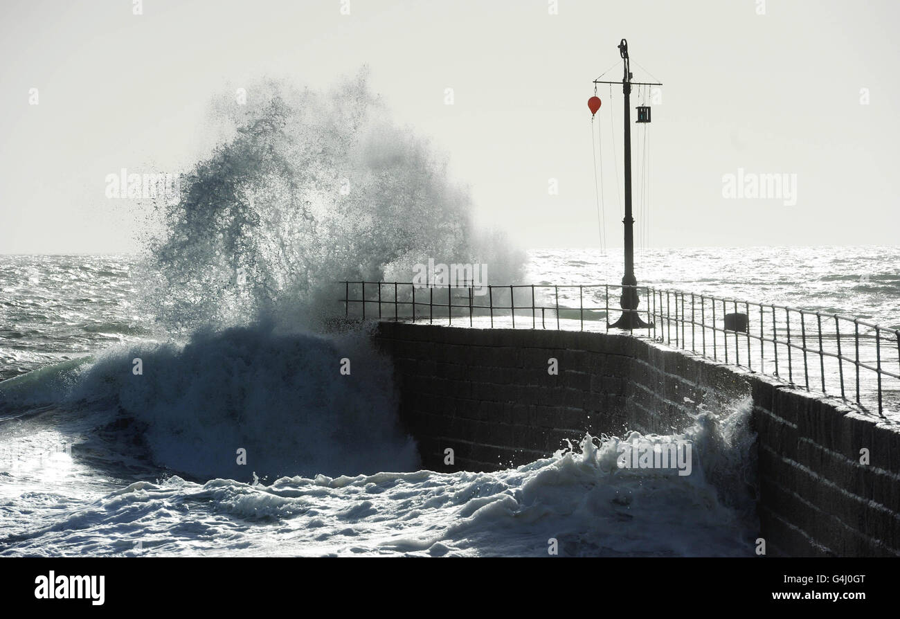 Waves break on the pier at Porthleven, Cornwall after hurricane Katia built a large swell in the Atlantic. Stock Photo
