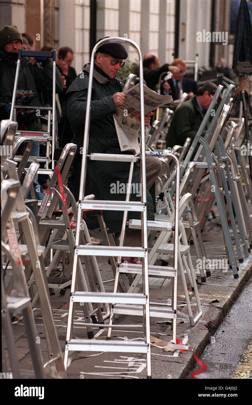 A photographer waits outside the Ritz hotel, London, where the world s media have gathered following speculation that the Prince of Wales and Camilla Parker Bowles will step out in public together for the first time at a 50th birthday dinner for Camilla's sister, Annabel Elliott. Stock Photo