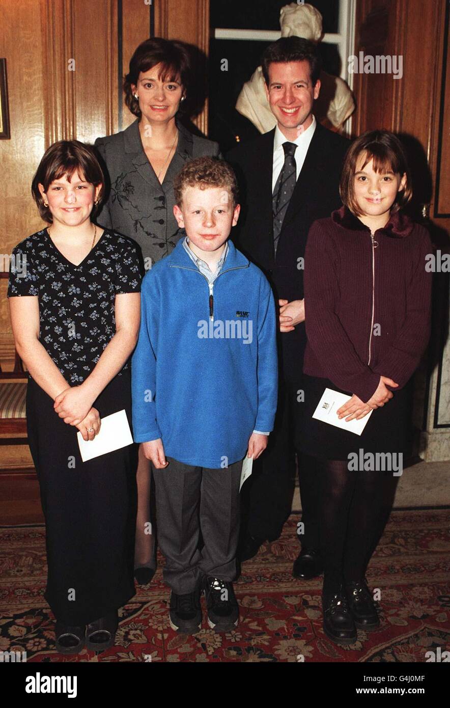 Cherie Blair, wife of British Prime Minister Tony Blair, with Christopher Leslie, MP for Shipley, and children from his constituency (l to r) Catherine Clark, Jonathon Blackburn and Louise Bowmaker, at a tea party hosted by Mrs Blair at 10 Downing Street. Stock Photo