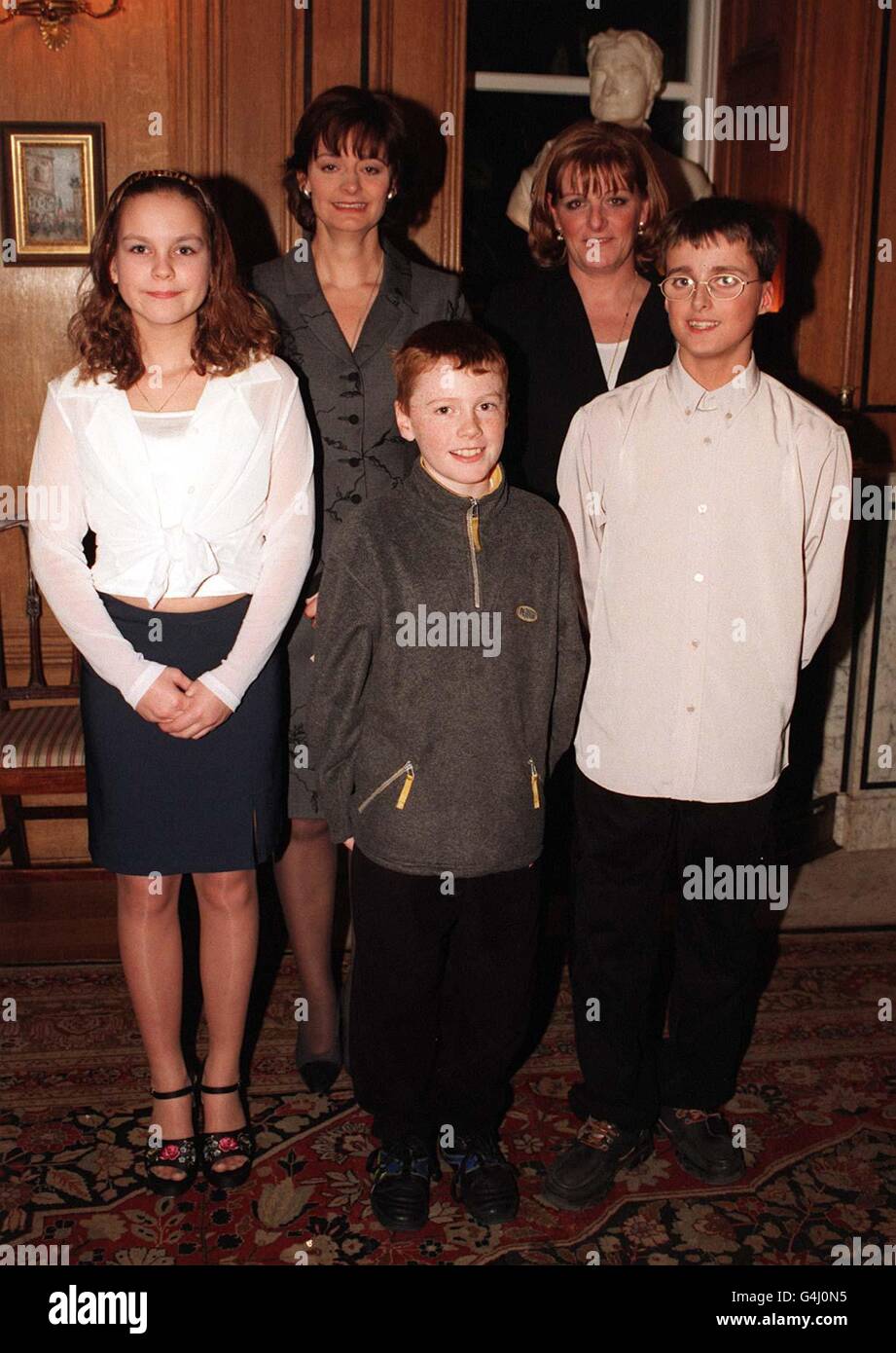 Cherie Blair, wife of Prime Minister Tony Blair, with Dawn Illsley, representing Eric Illsley, MP for Barnsley Central, and local children (l to r) Donna Young, Conor Carroll and Oliver Geldart, at a children's tea party in 10 Downing Street hosted by Mrs Blair. Stock Photo