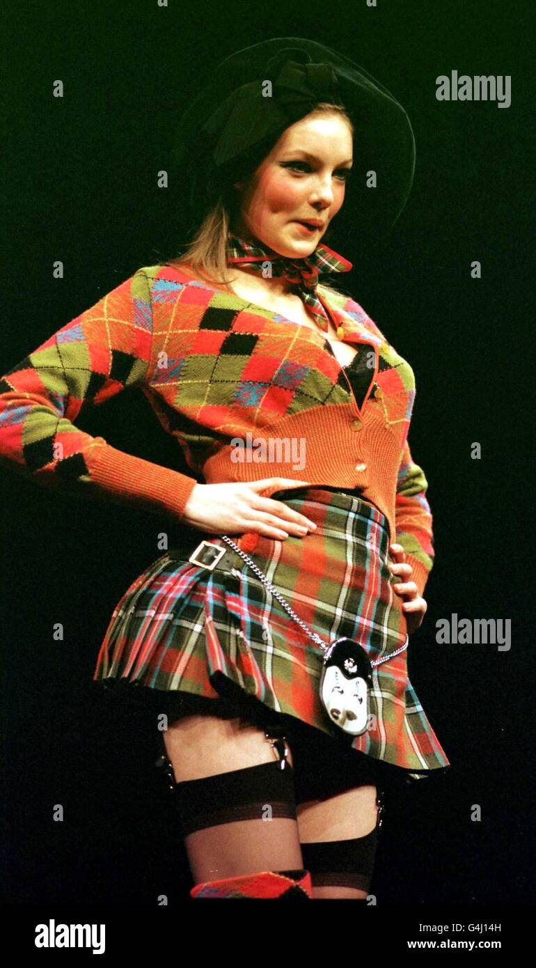 A model presents a tartan kilt and cardigan creation from the Vivienne Westwood Spring/Summer collection of fashion at the Scottish Exhibition and Conference Centre in Glasgow, the first time that Ms Westwood has shown her collection on the catwalk outside London. Stock Photo