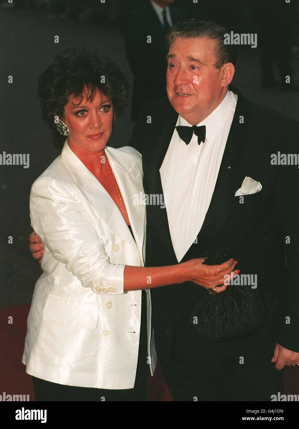Library file 262144-9, dated 29.8.95. Bryan Mosely arrives for the National Television Awards with Coronation Street co-star Amanda Barrie, who plays Alma Baldwin in the Granada TV series . The actor died today (Tuesday), aged 67, just weeks after the final appearance in the series of his character, Alf Roberts. See PA story DEATH Mosely. Photo by Stefan Rousseau/PA Stock Photo
