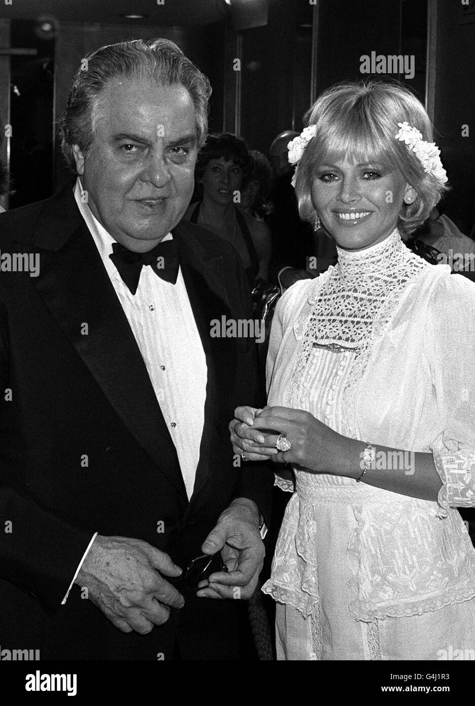 James Bond Producer Albert Broccoli with actress Britt Ekland, who co-stars with Roger Moore in the new James Bond film, at the premiere of 'Moonraker'. Stock Photo