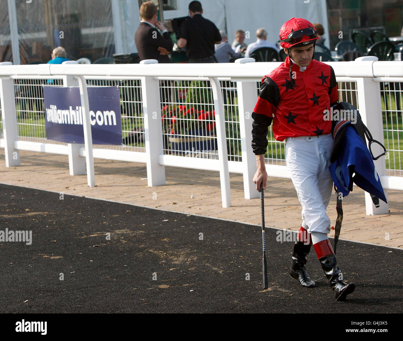 Jockey Lee Newman after his ride on Full Toss in the Isle Of Skye 8-Y-O Blended Scotch Whisky Handicap Stock Photo