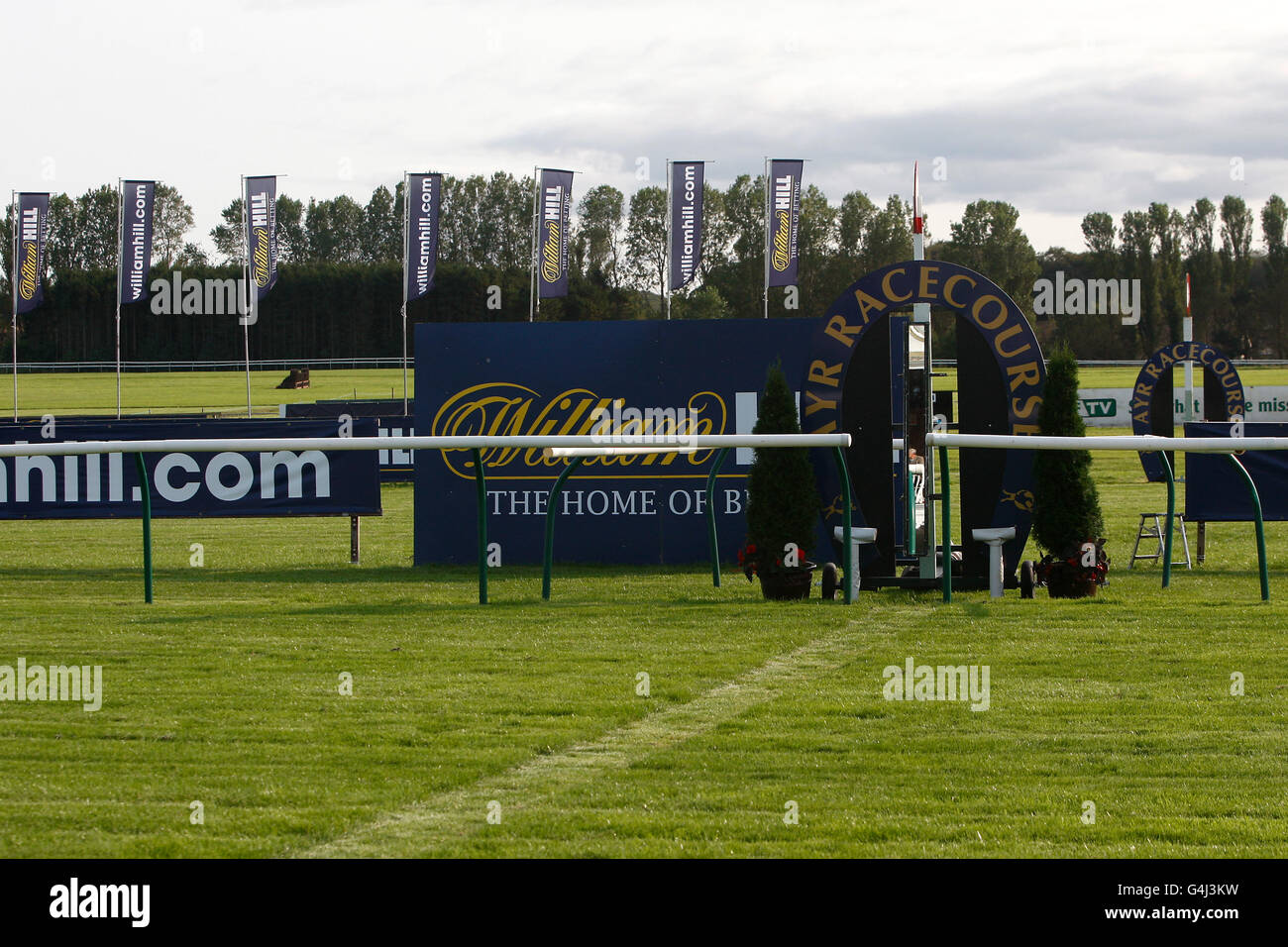Horse Racing - William Hill Ayr Gold Cup Festival - Day One - Ayr Racecourse. William Hill signage at the winning post at Ayr Racecourse Stock Photo