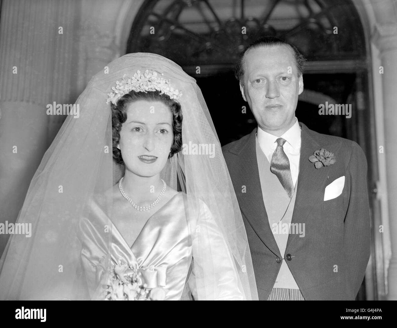Diana Bowes-Lyon, niece of the Queen Mother, pictured with Prince Georg of Denmark, who was to give away the bride, as they left London's Connaught Hotel in Carlos Place for the wedding ceremony which was to take place at Westminster Abbey. Stock Photo