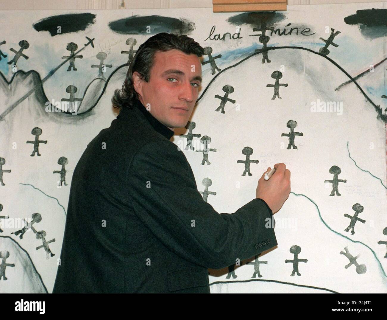 Tottenham Hotspur soccer star David Ginola at the Imperial War Museum in London, to lend support to the historic treaty banning landmines. He signed a picture by Welsh artist Iwan Bala, which will be displayed at the Museum as a vivid memorial of the campaign. Stock Photo