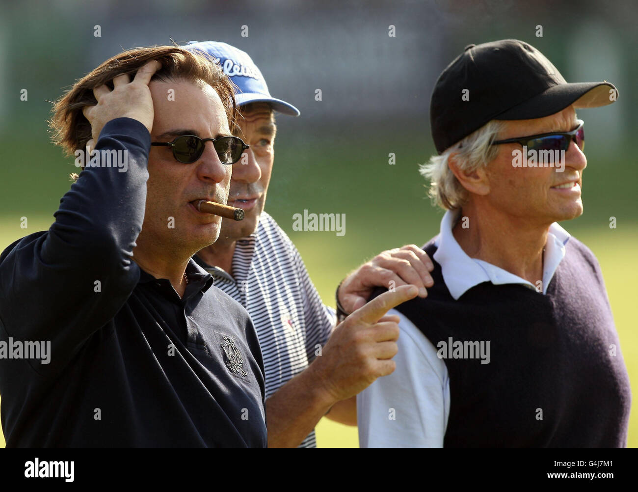 (left-right) Andy Garcia, Huey Lewis and Michael Douglas on the 1st hole during a practice day for the Alfred Dunhill Links Championships at the Old Course, St Andrews. Stock Photo