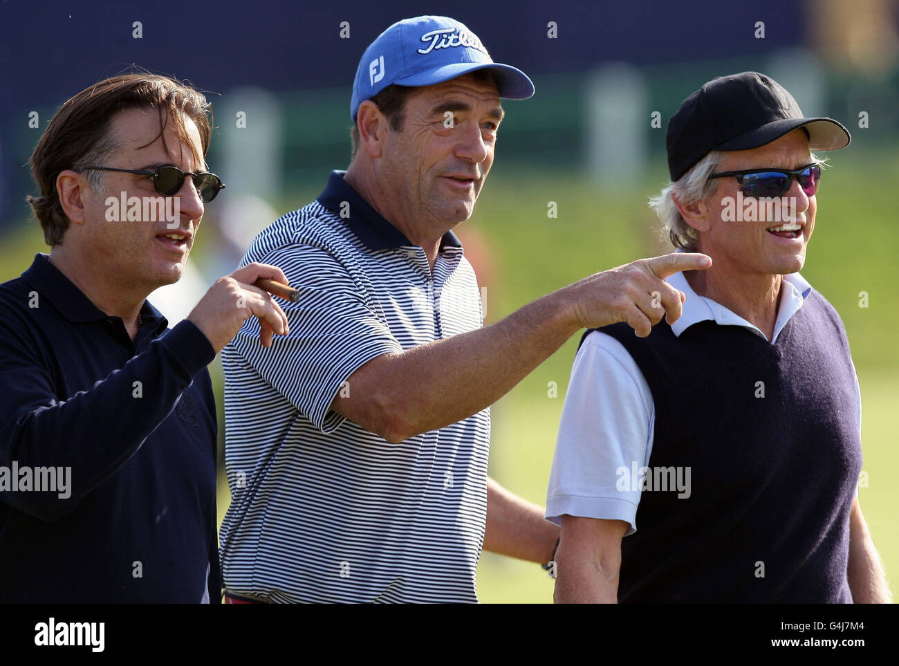 (left-right) Andy Garcia, Huey Lewis and Michael Douglas on the 1st hole during a practice day for the Alfred Dunhill Links Championships at the Old Course, St Andrews. Stock Photo