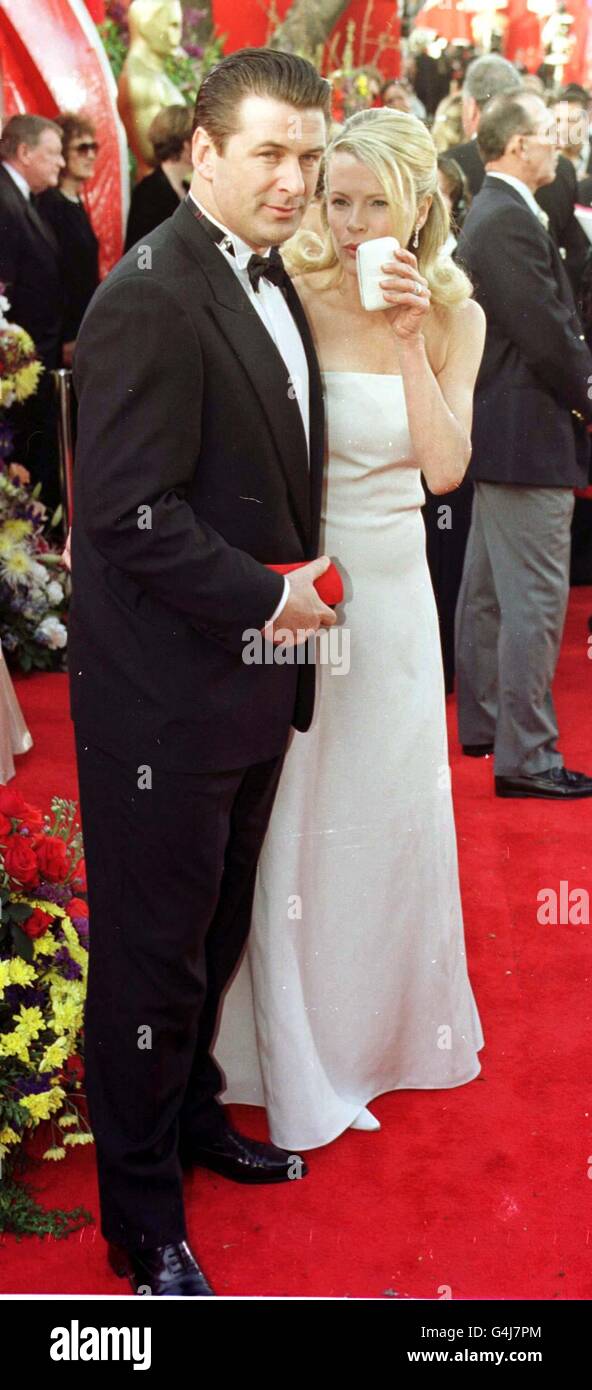 American actor Alec Baldwin with his wife, actress Kim Basinger, at the Dorothy Chandler Pavilion in Los Angeles for the 71st annual Academy Awards. 5/4/04: Movie star Kim Basinger is selling a collection of jewels given to her by former husband, actor Alec Baldwin, it emerged. The Batman star is ridding herself of the trinkets at Christie's in New York, as part of a sale of magnificent jewels. Stock Photo