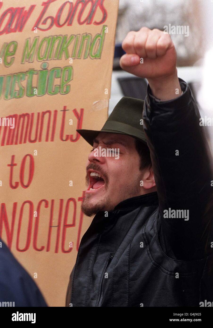 Protesters gather outside the Houses of Parliament in London awaiting the fate of the ex-Chilean Head-of-State General Pinochet, whose future is to be decided by the House of Lords. Stock Photo