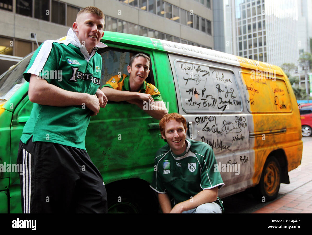 Ireland fans Daniel O'Connor, Daniel McLoughlin and Kebin O'Connor from Donegal with their van that has been signed by members of the Irish team outside the team hotel in Wellington, New Zealand. Stock Photo