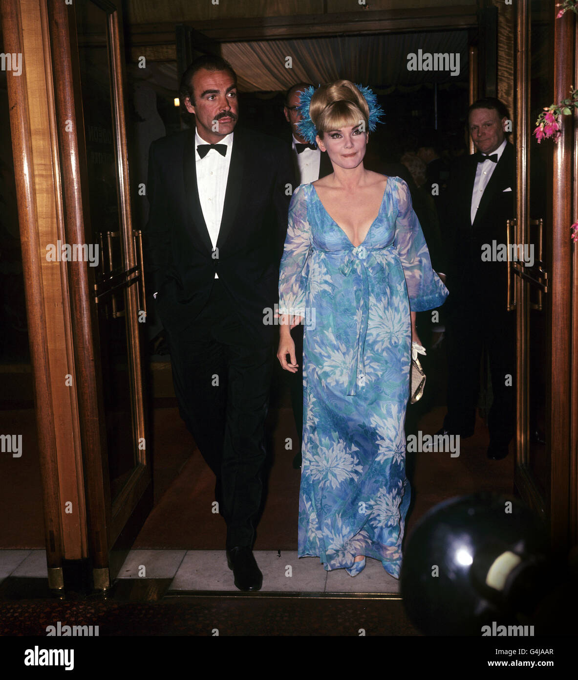 Sean Connery, who plays James Bond in 'You Only Live Twice' arriving with his wife, actress Diane Cilento, for the premiere of the film at the Odeon, Leicester Square. Stock Photo