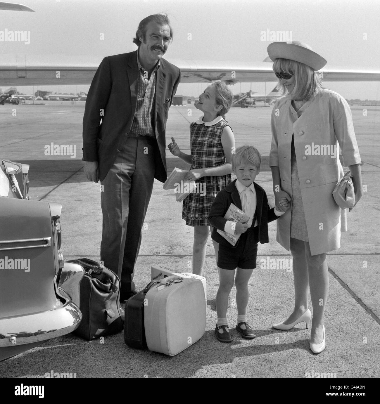 Actor Sean Connery with his actress wife Diane Cilento and their children Gigi, aged 9, and Jason, aged 4, before flying to Nice, France. Stock Photo