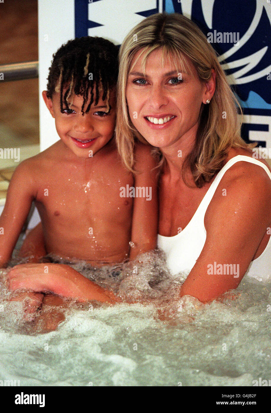 Former Olympic swimmer Sharron Davies enjoys a jacuzzi with her son Elliott at the Marriot Hotel in London's Marble Arch, at the launch of her Mile Swim Challenge in aid of the Imperial Cancer Research Fund. Stock Photo