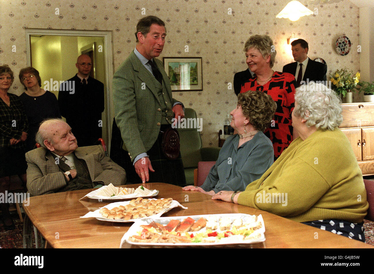 The Prince Of Wales speaks with residents at the Seaforth House Residential and Day Care Centre in Golspie, Scotland. The Prince's last visit to the centre was when he opened it 19 years ago. Stock Photo
