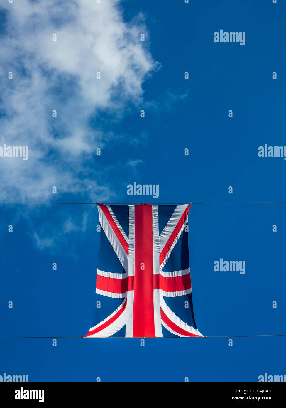 Union Jacks flags appear to float in a blude sky Stock Photo Alamy