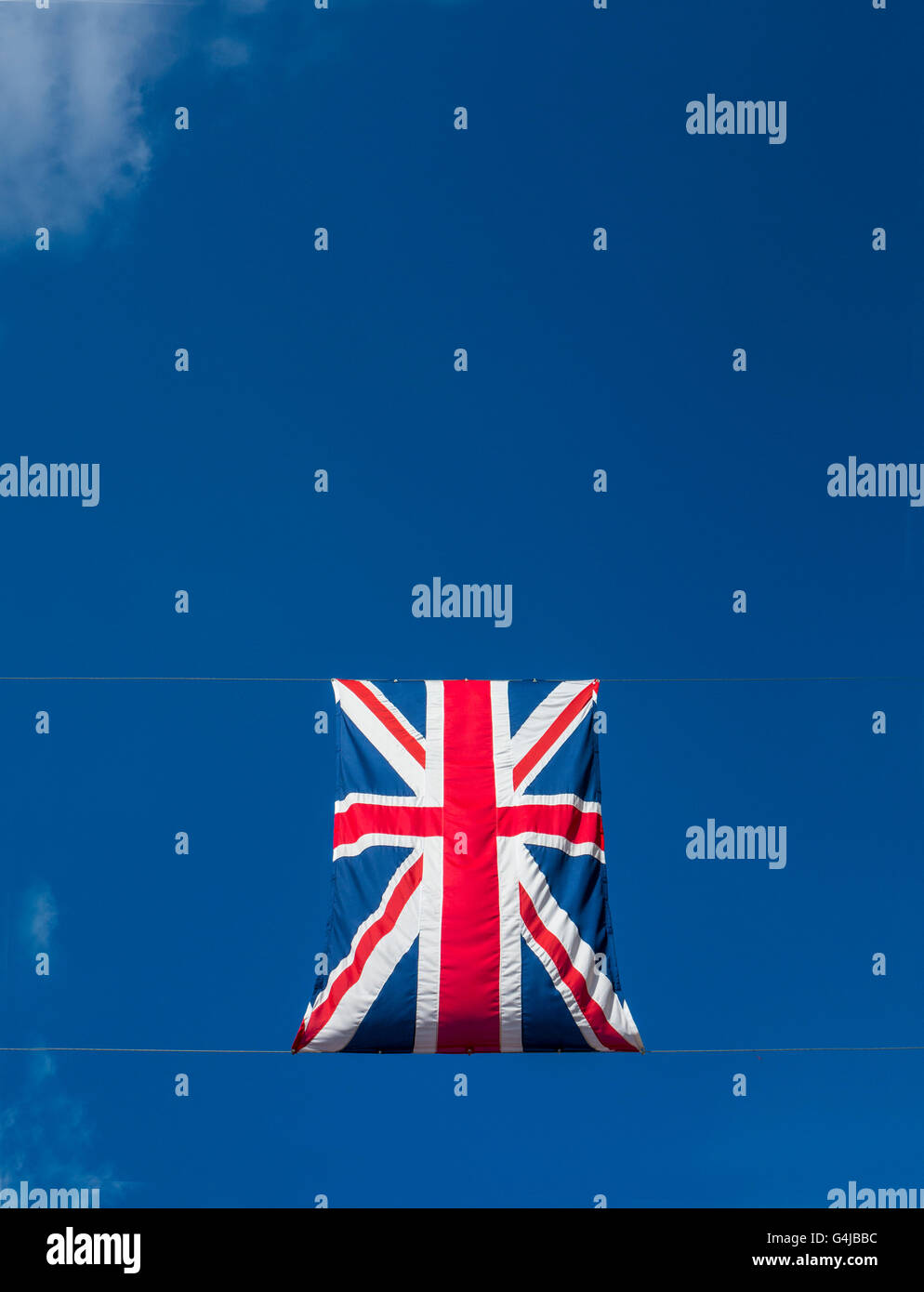 Union Jacks flags appear to float in a blude sky Stock Photo Alamy