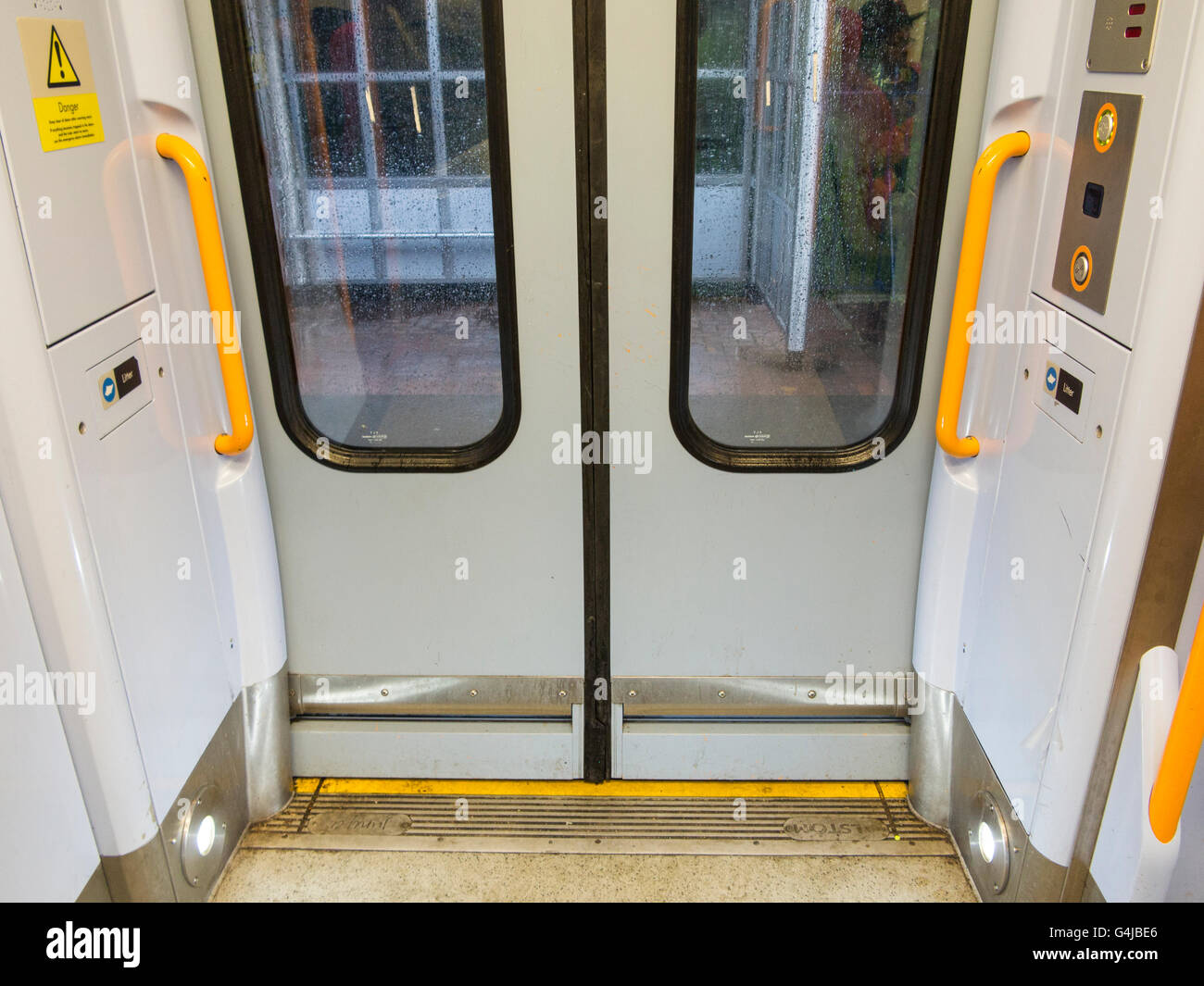 Closing train doors on a Southern Rail in a rainstorm Stock Photo Alamy