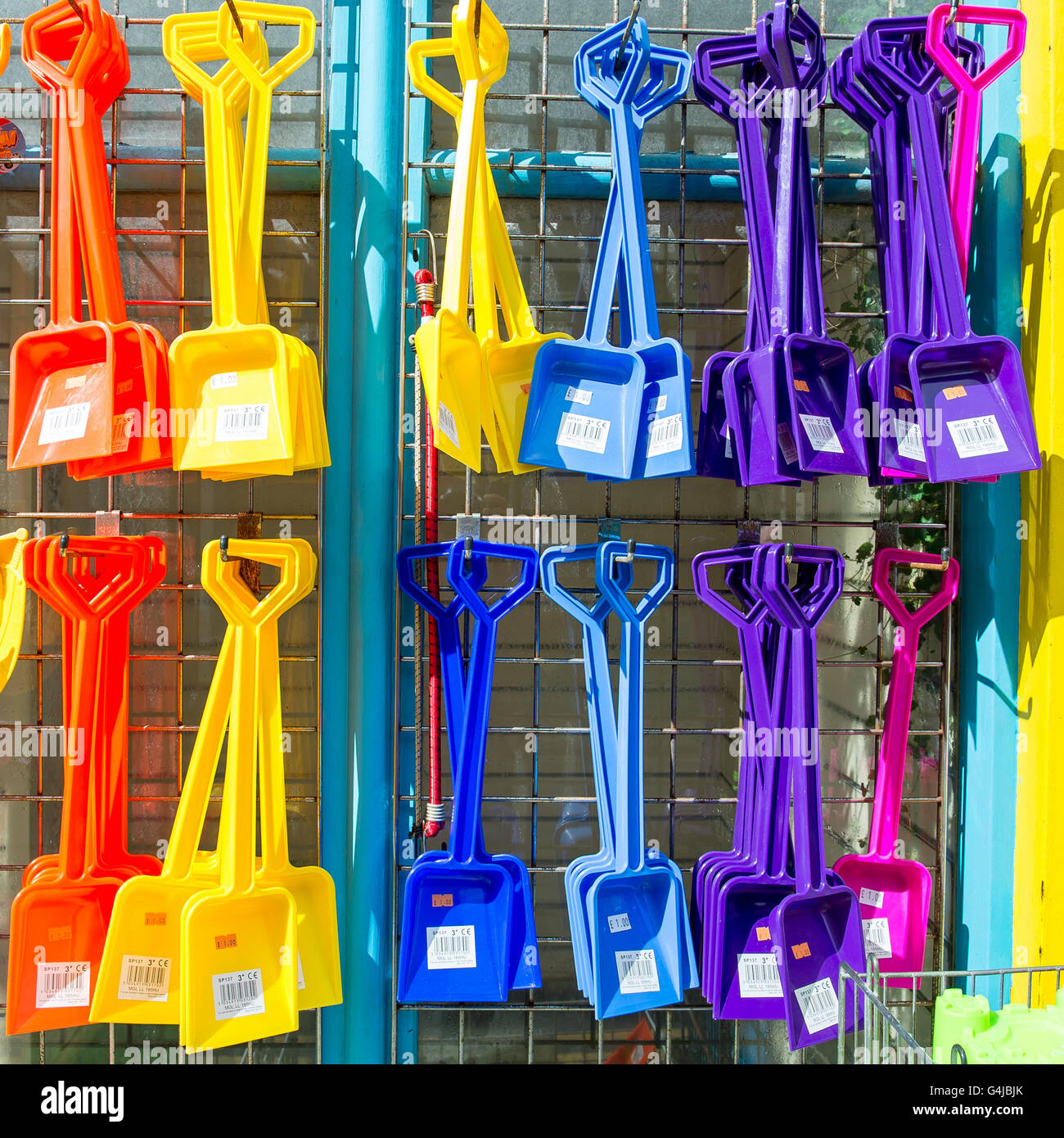 Colourful seaside beach spades on display Stock Photo