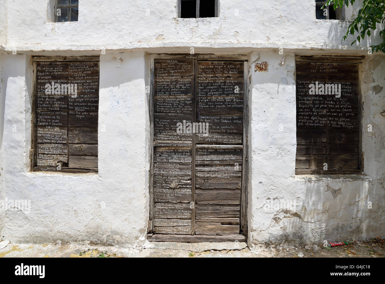 Poems written on door and windows in Pyrgos village, Tinos island, Greece  Stock Photo - Alamy