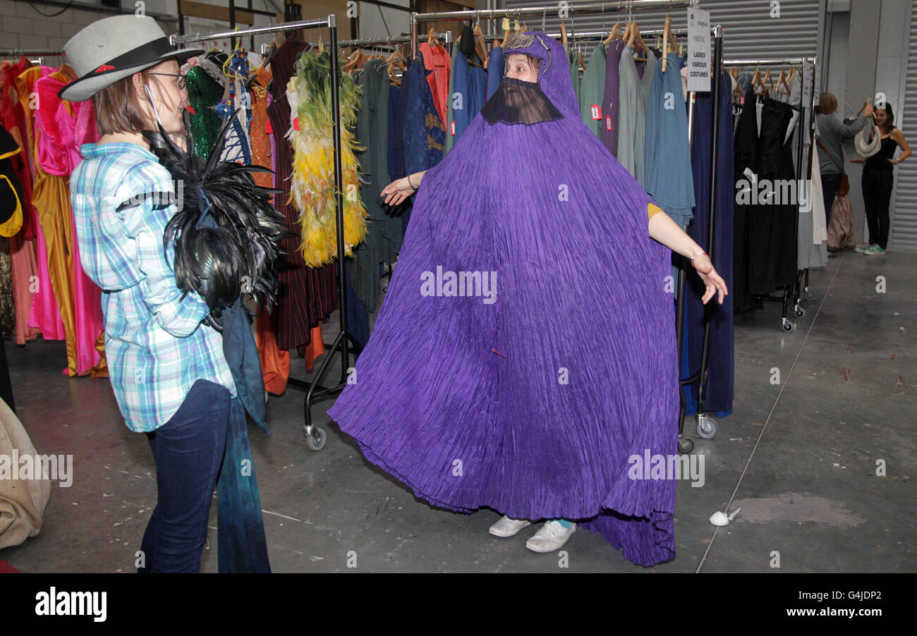 People try clothes on during a costume sale from Royal Opera House productions in Purfleet, Essex. Stock Photo