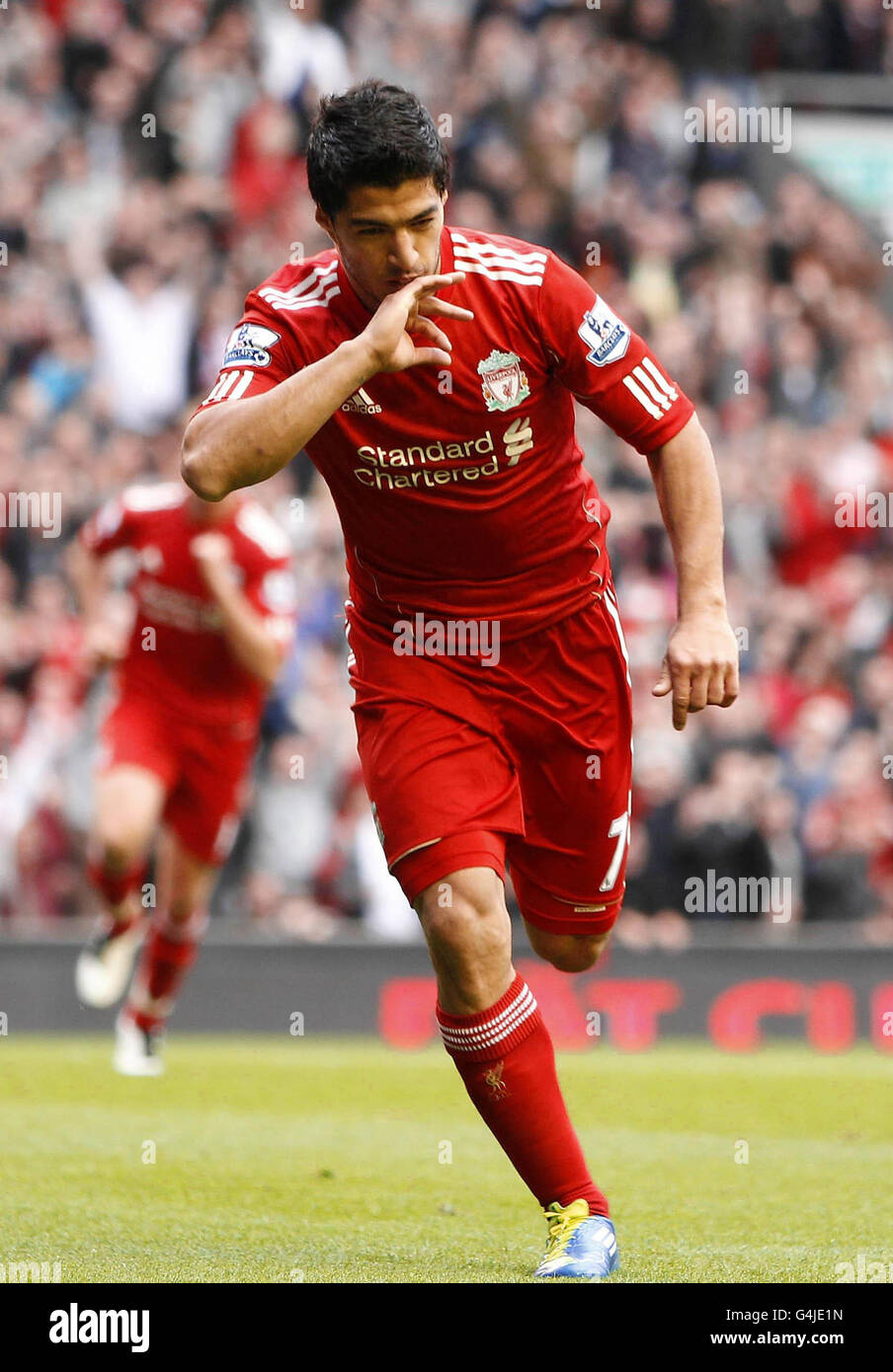 Liverpool's Luis Suarez celebrates his goal during the Barclays Premier  League match at Anfield, Liverpool Stock Photo - Alamy, image size:904x1390