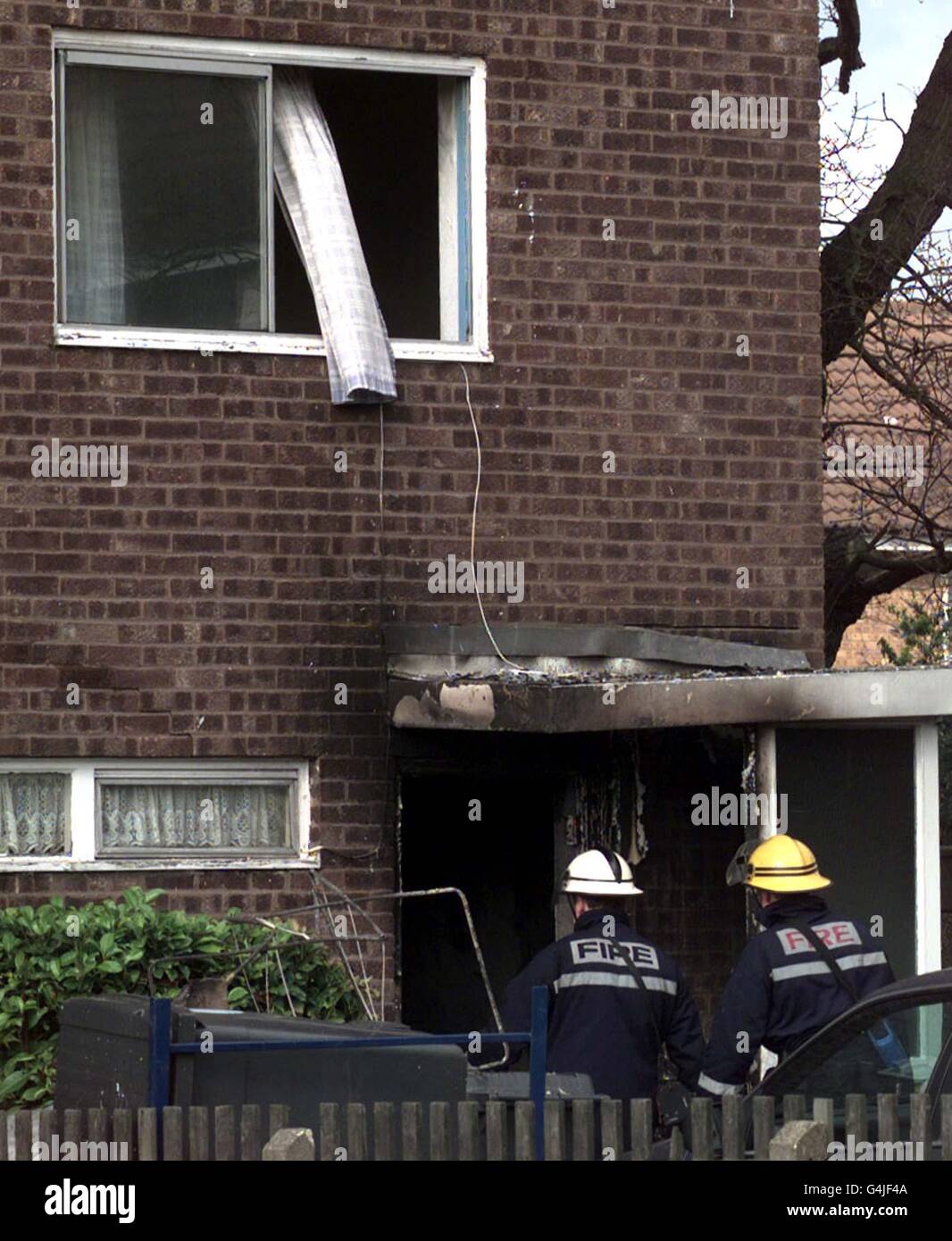 Firemen at the house in Bellamy Road, Chingford, where detectives and fire investigators try to establish the cause of a blaze which claimed seven lives. Three children were among the dead. One adult managed to escape. * 15/5/2000: An unemployed disc jockey today admitted the killings of seven people, which wiped out four generations of a family, whose ages ranged from two years to 76, in the fire. Stock Photo