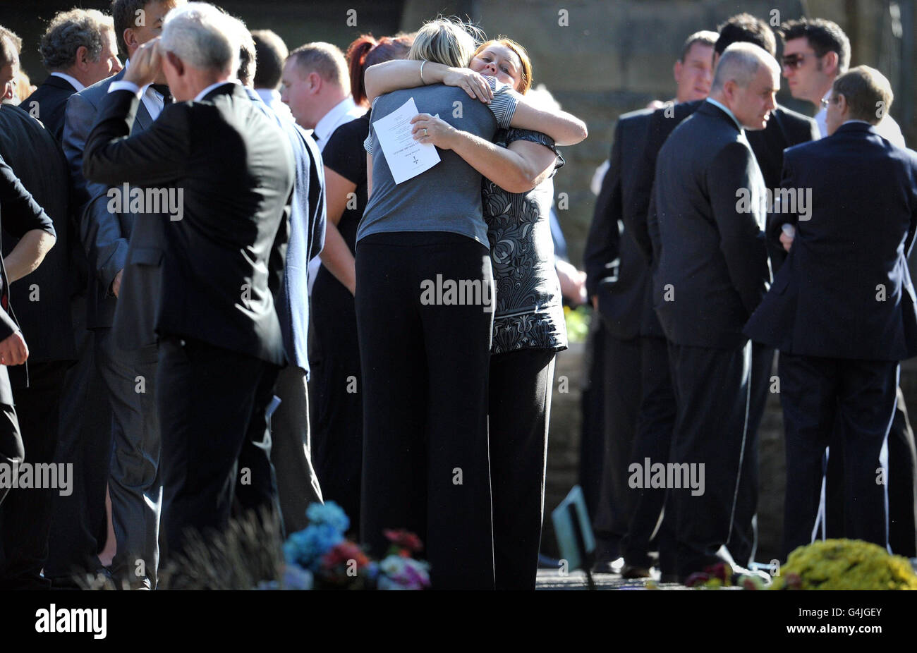 Mourners outside Morriston Crematorium in Swansea, during the funeral