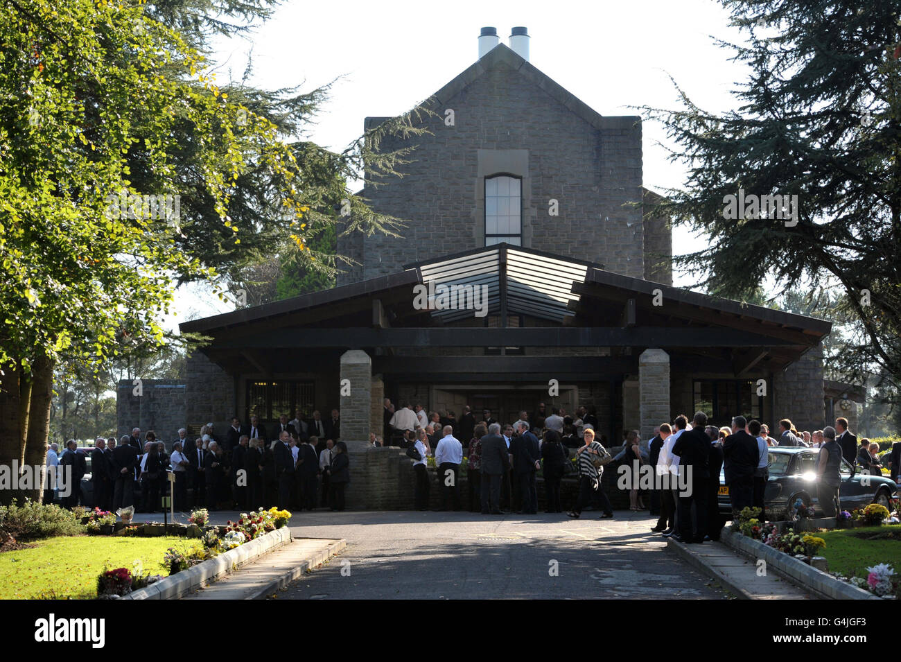 Mourners outside morriston crematorium in swansea hires stock
