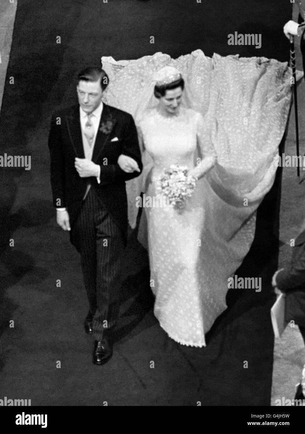 Princess Alexandra and her bridegroom Angus Ogilvy walking down the aisle leaving Westminster Abbey in London Stock Photo