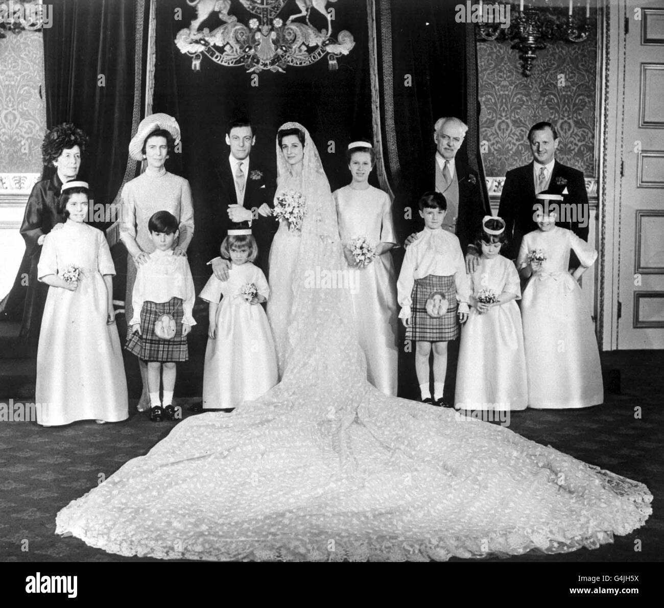Princess Alexandra and her bridegroom Angus Ogilvy pose with members of their family during the reception at St. James's Palace in London after their wedding ceremony at Westminster Abbey. Stock Photo