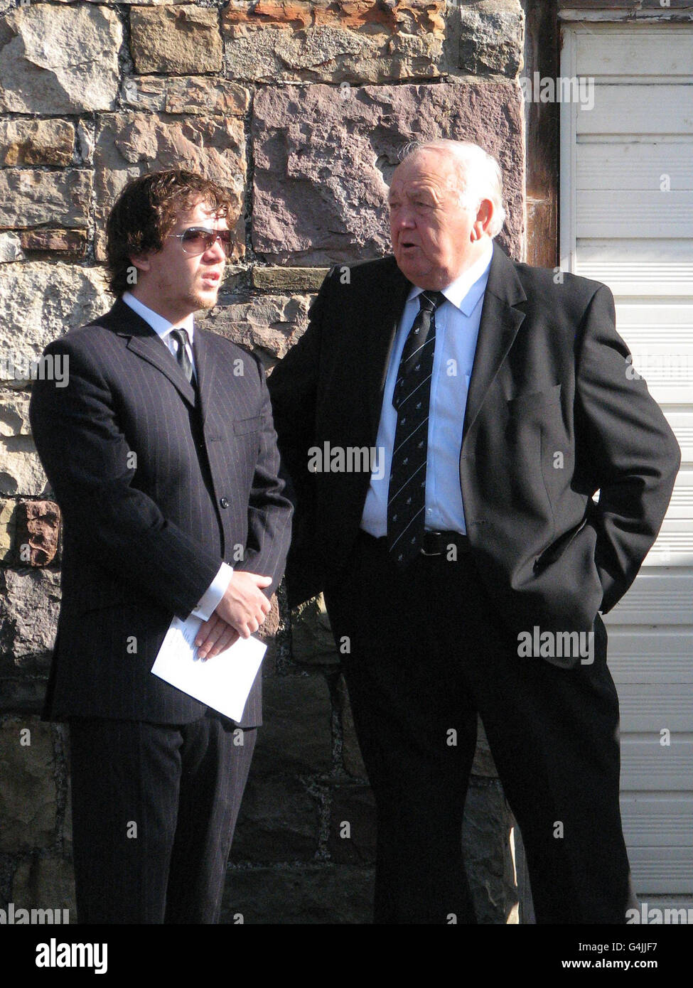 Welsh actor Steven Meo, left, and former wales rugby coach, Clive Rowlands attend the funeral of miner Garry Jenkins, at Beulah Chapel, Lower Cwmtwrch. Stock Photo