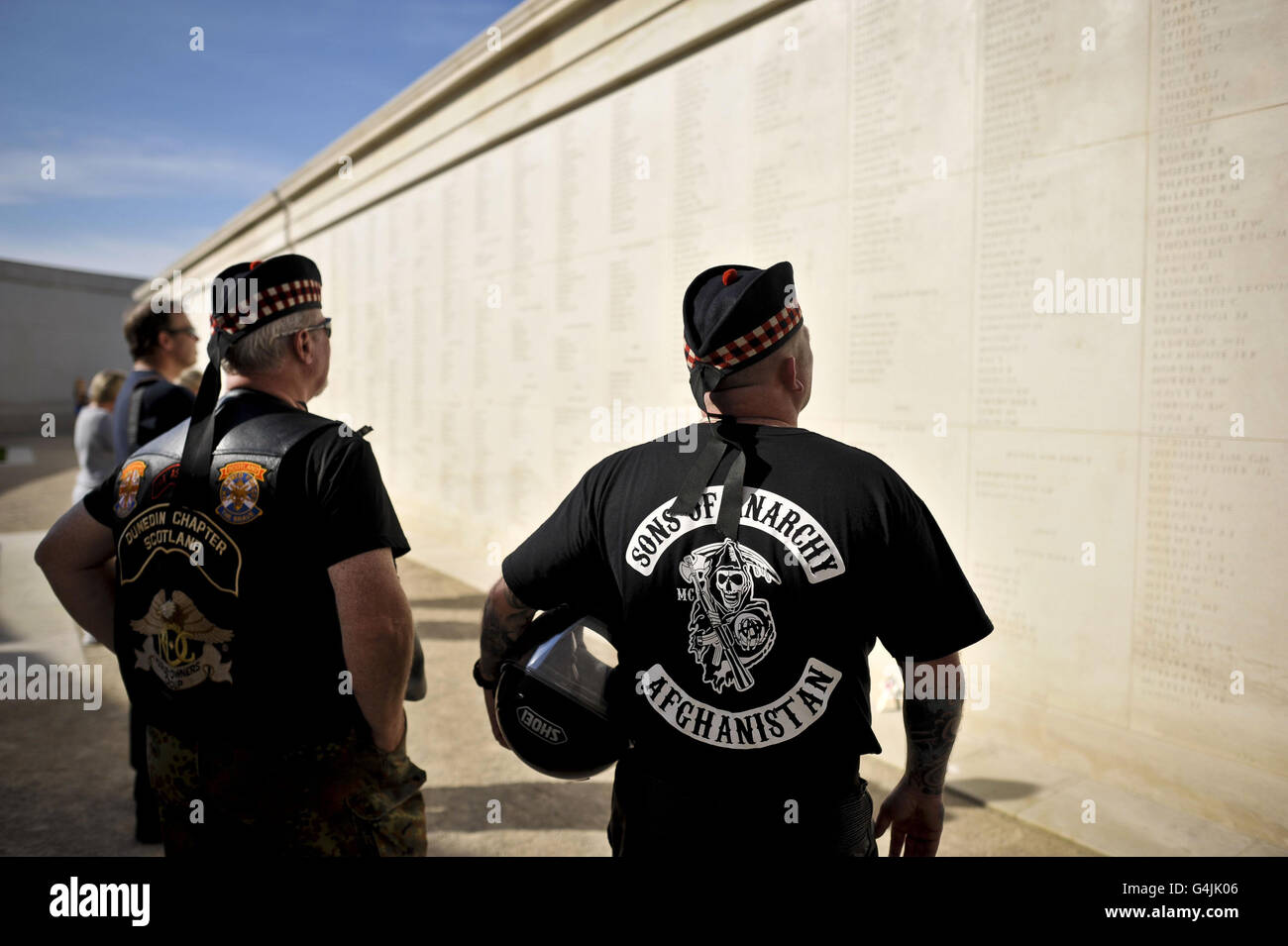 Bikers read names engraved on the walls at the fourth annual Ride to the Wall event where motorcyclists make their pilgrimage to the The National Memorial Arboretum, Alrewas, Staffordshire, to show their support for the armed forces. Stock Photo