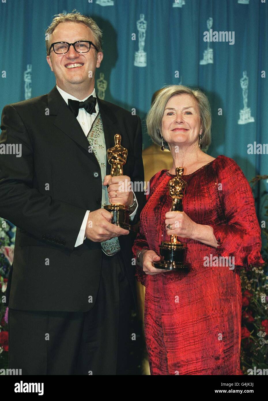 Martin Child and Jill Quertier with their Oscars, which they won for Best Art Direction for their work on the film 'Shakespeare in Love', at the 71st annual Academy Awards in Los Angeles. Stock Photo