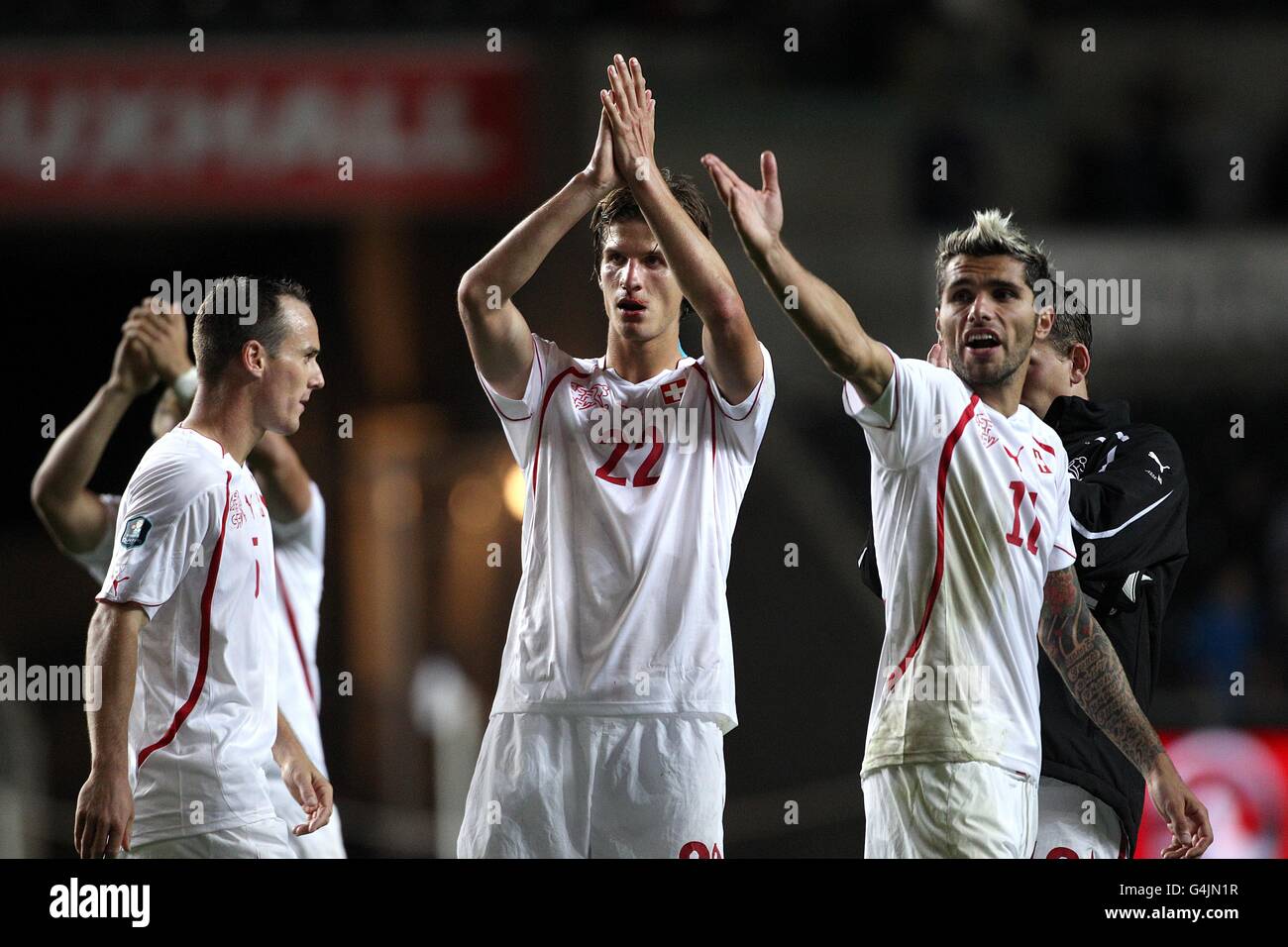Soccer - UEFA Euro 2012 - Qualifying - Group G - Wales v Switzerland - Liberty Stadium. Switzerland's Timm Klose (centre) and Valon Behrami (right) after the final whistle Stock Photo