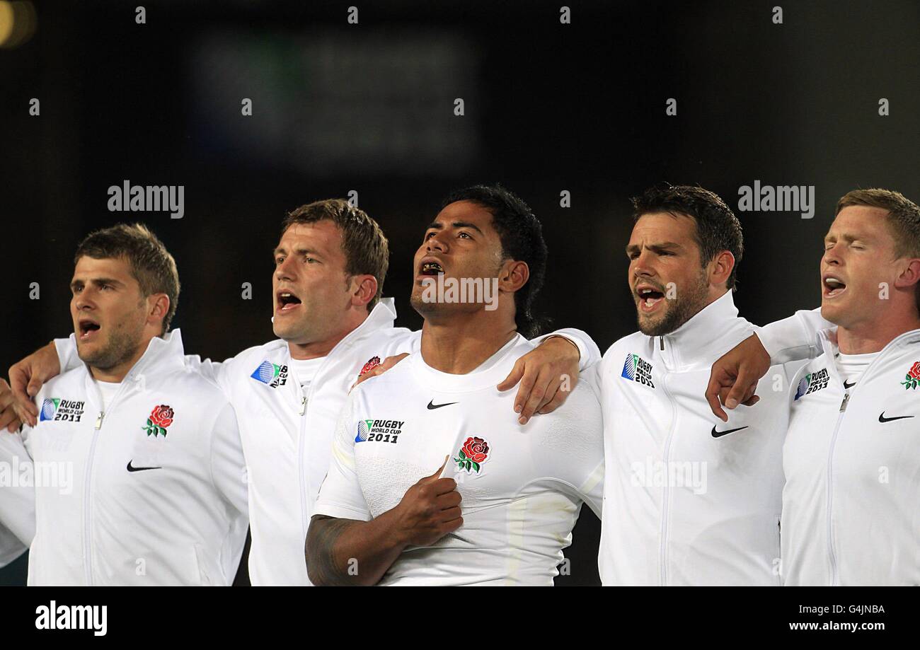 England players including Manu Tuilagi (centre), Ben Foden (second right), Chris Ashton (right), Mark Cueto (second left) and Richard Wigglesworth (left) sing the national anthem. Stock Photo