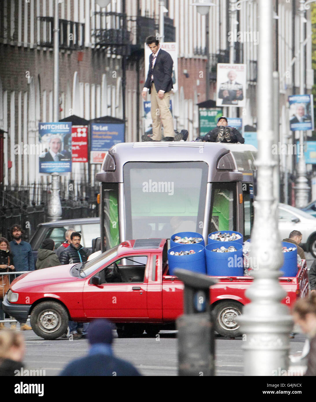 A stunt man is seen on a fake Luas tram during filming of Ek Tha Tiger, a spy-thriller featuring,l Bollywood elements of music and dance, on Dublin's Mount Street. Stock Photo